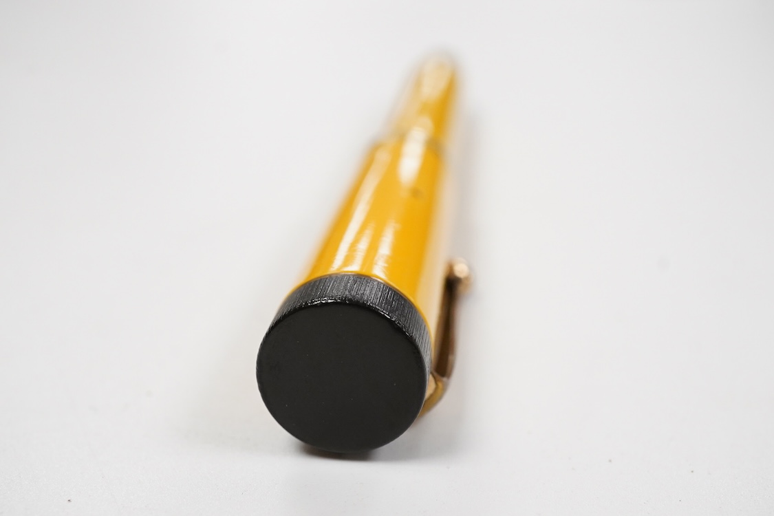 A Parker Lucky Curve Duofold Senior in mandarin yellow with 14ct Duofold nib